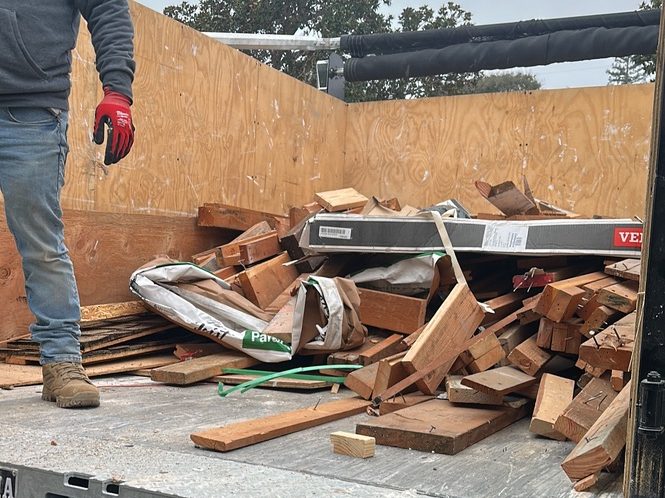 Lumber and construction debris loaded in the dump truck